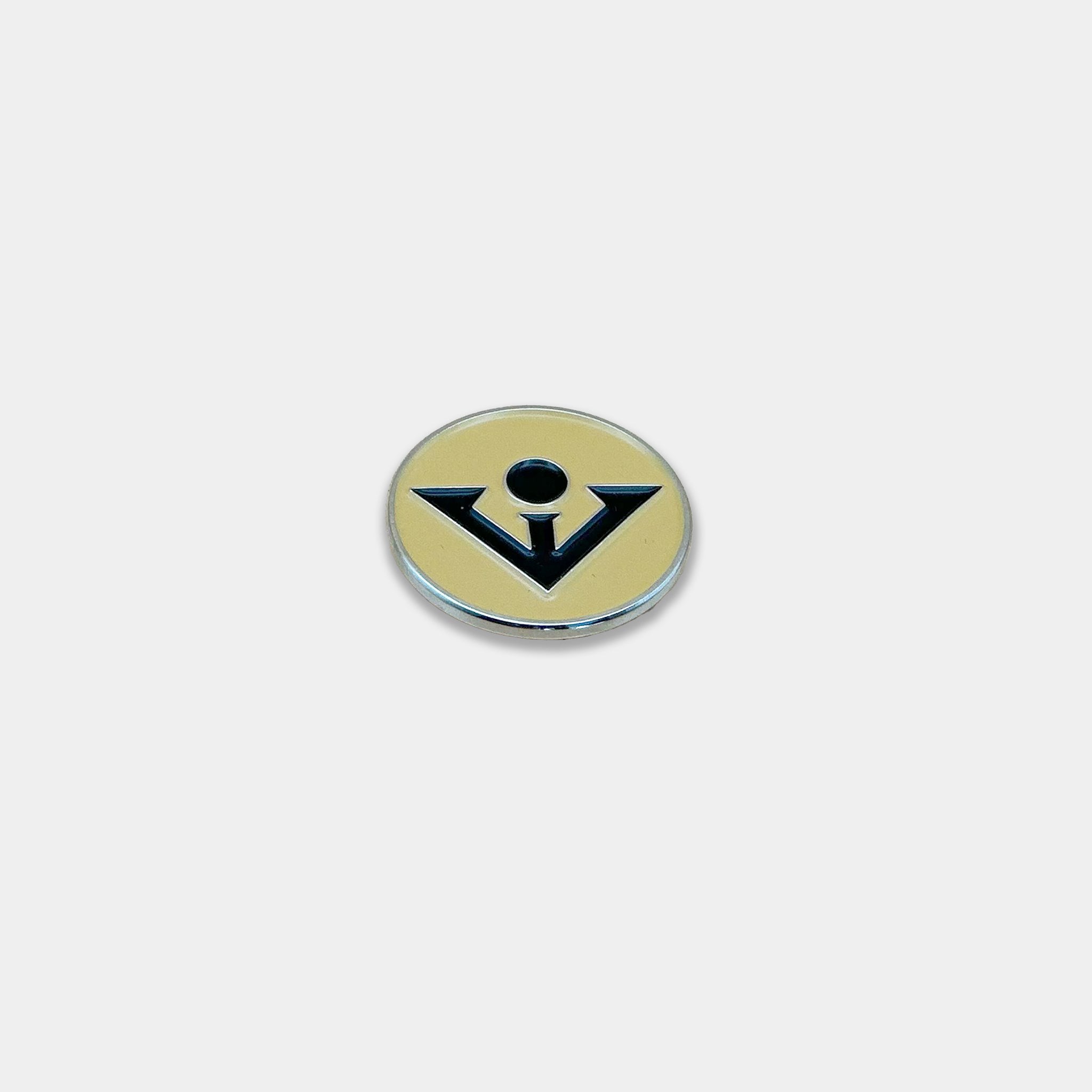 Black and tan magnetic golf ball marker.
