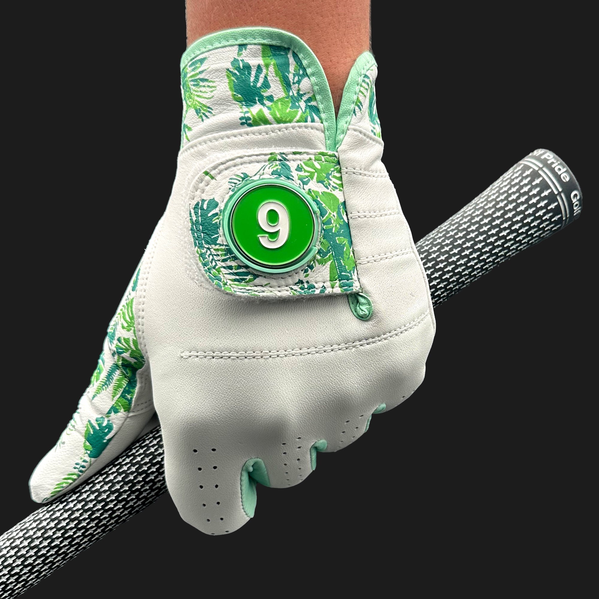 Golf glove with floral pattern and number 9 on a black background