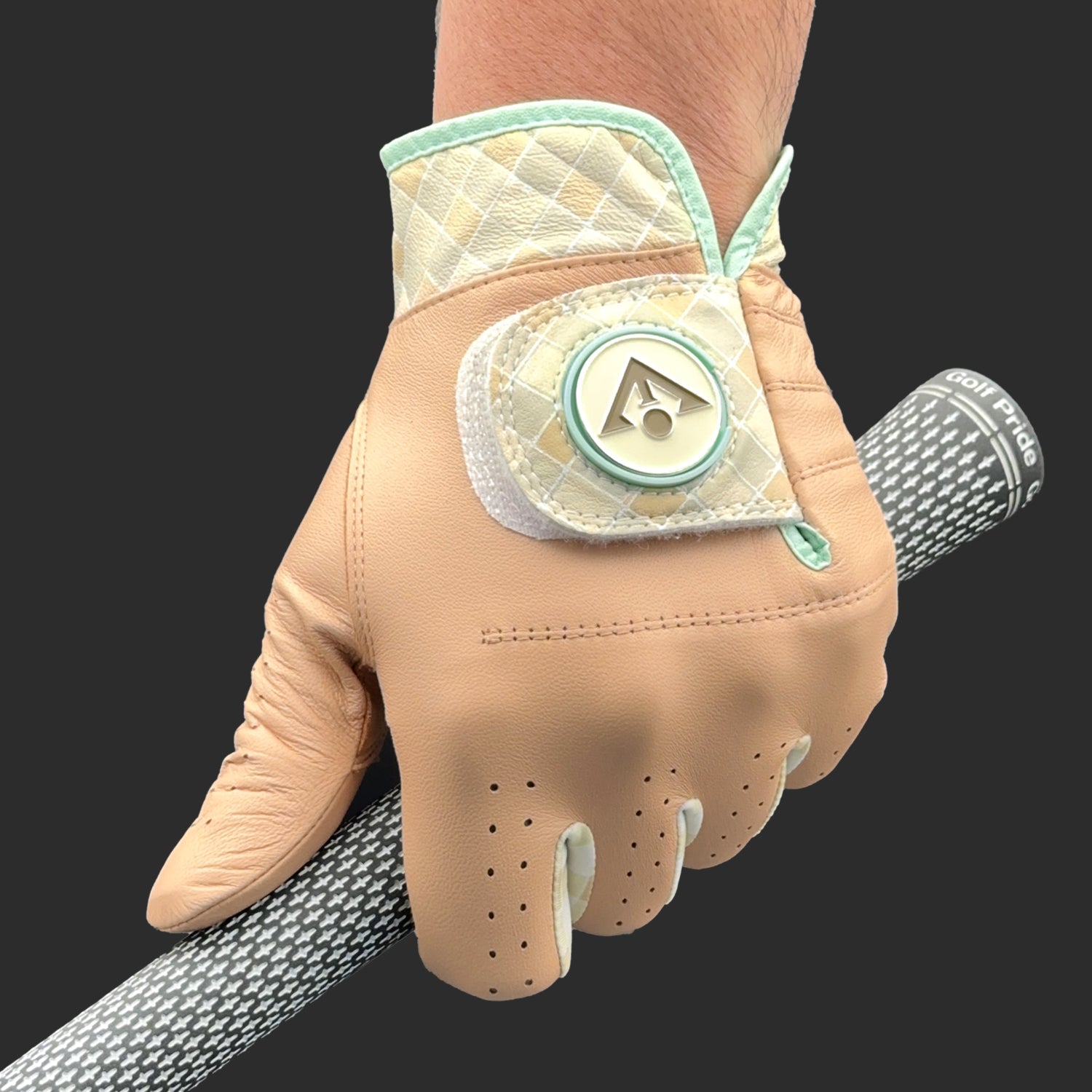 Beige golf glove with green accents on a black background