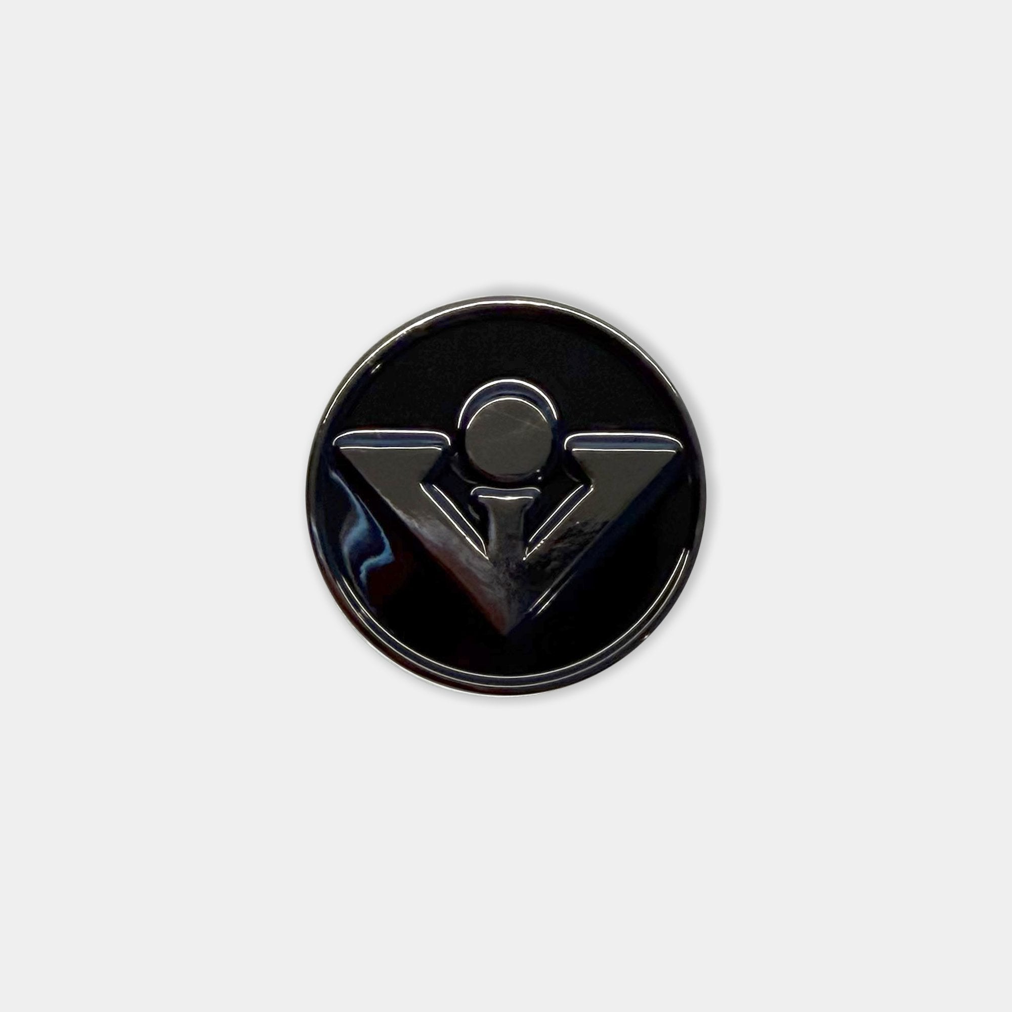 All black magnetic golf ball marker by VivanTee Golf on a white background.