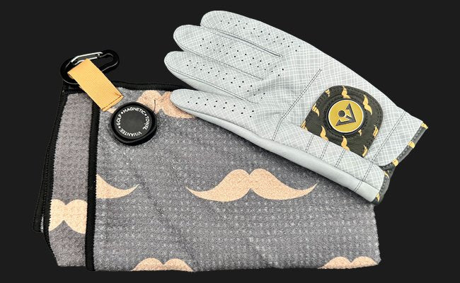 Magnetic golf towel and golf glove set – fashionable golf accessories featuring a mustache-patterned magnetic towel and glove with ball marker. Stylish and functional golf gear.