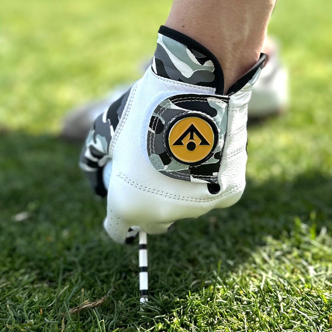 Close up of camo golf glove with ball marker by VivanTee Golf.