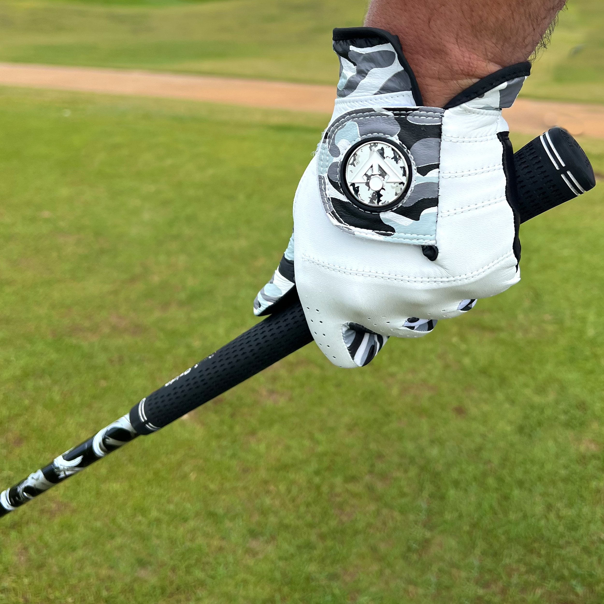 Men's Gowanus Ghost Golf Glove by VivanTee Golf in Camo holding a golf club in black and white.