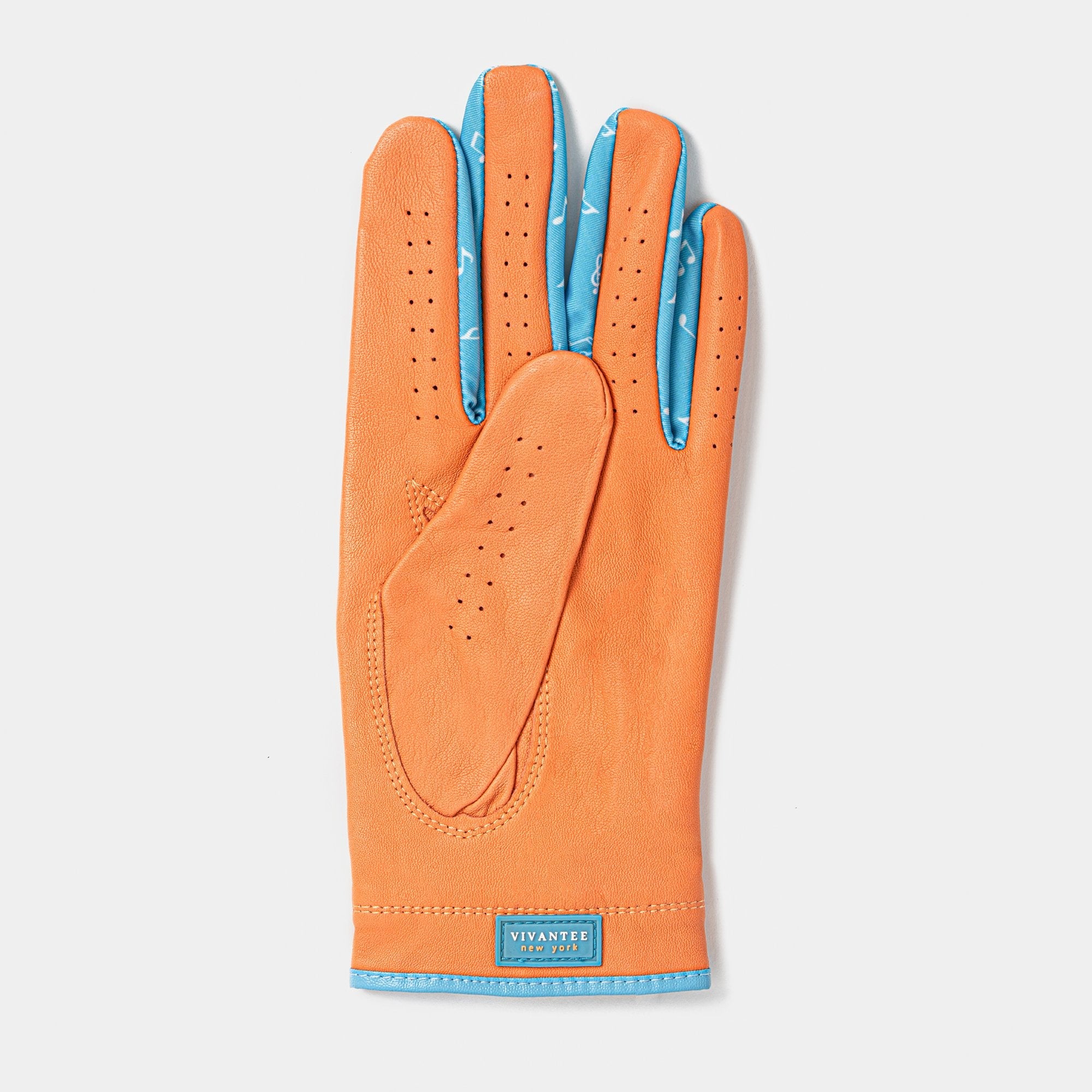 Orange golf glove with blue accents on a light gray background.