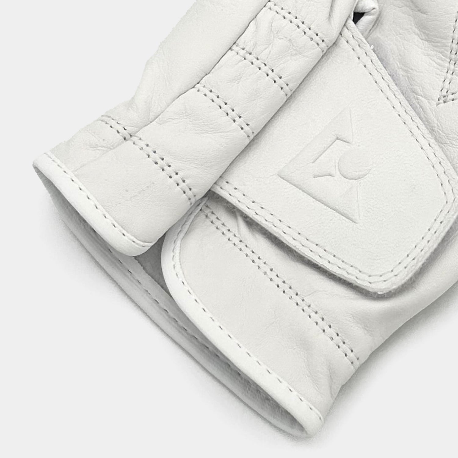 Close-up of a white golf glove with a VivanTee logo on a light gray background