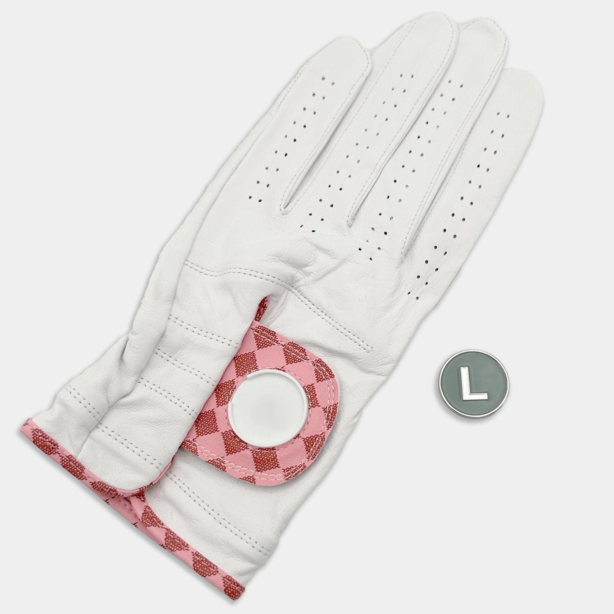 White golf glove with pink checkered pattern on a light gray background