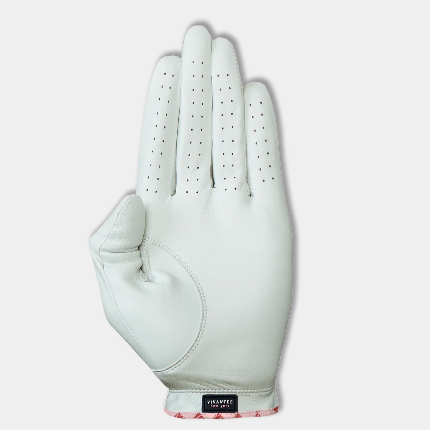 White and pink women's golf glove bottom showing palm and VivanTee logo.