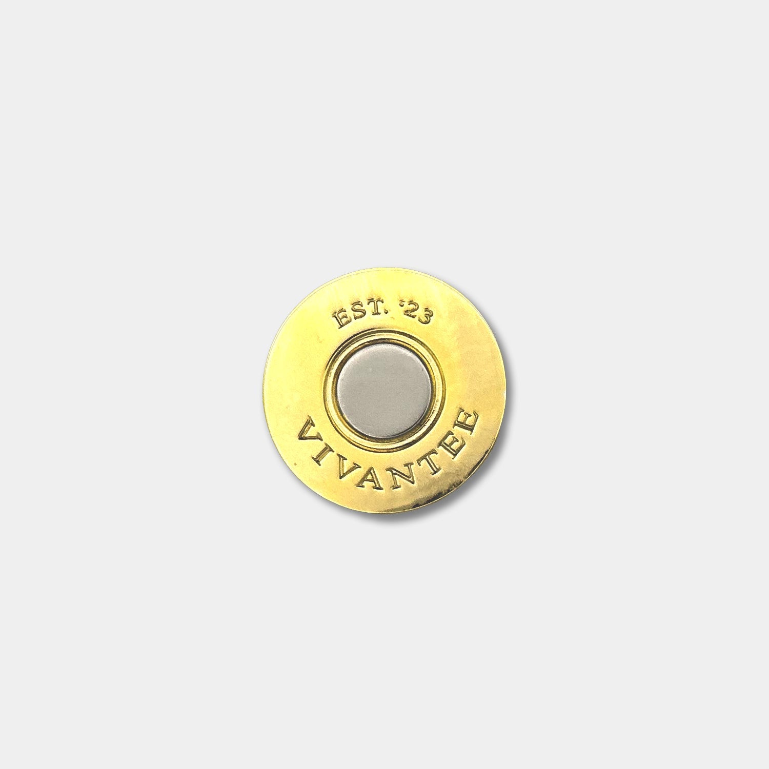 Top view of The Marksmen shotgun shell-style golf ball marker by VivanTee Golf.