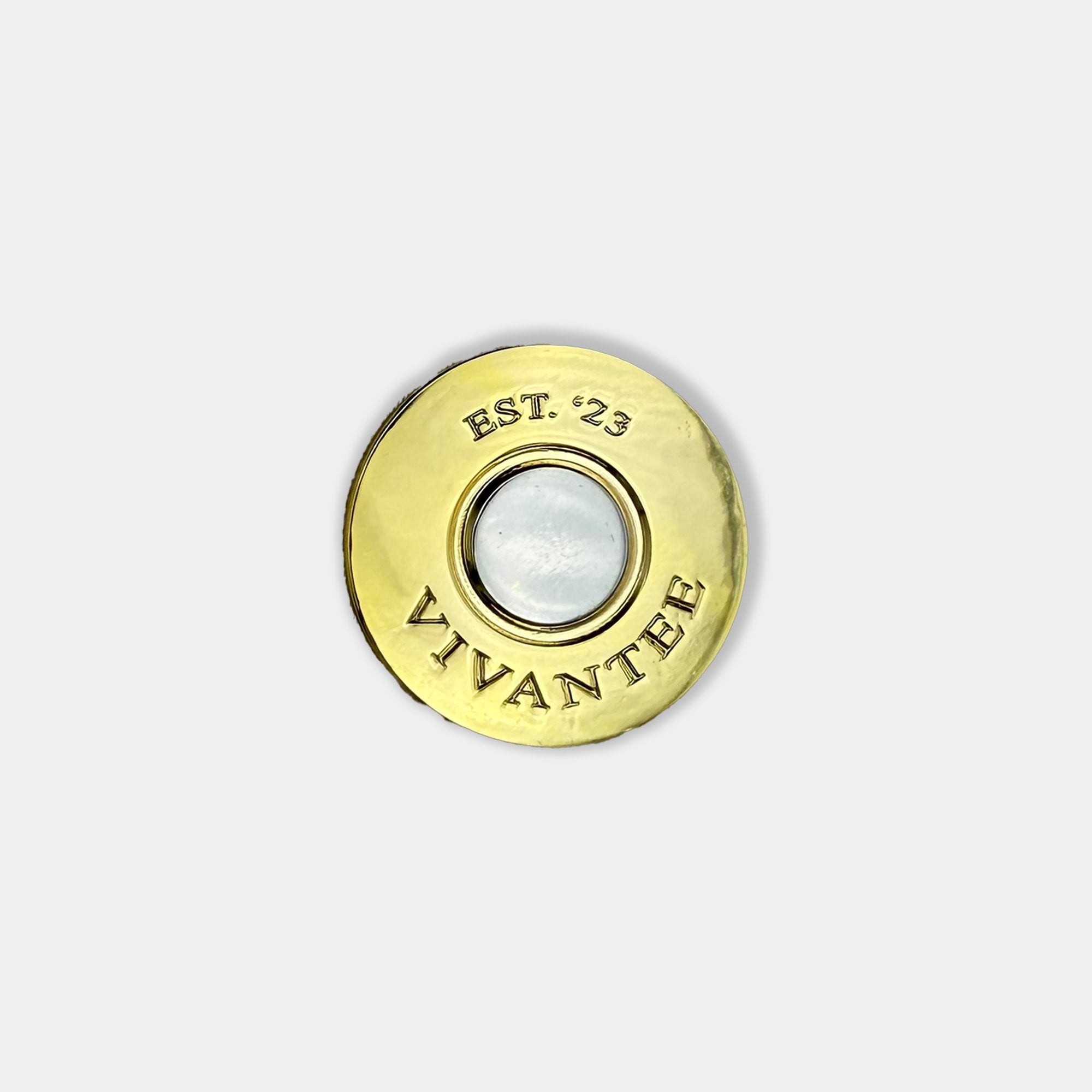 Top view of The Marksmen shotgun shell-style golf ball marker by VivanTee Golf.