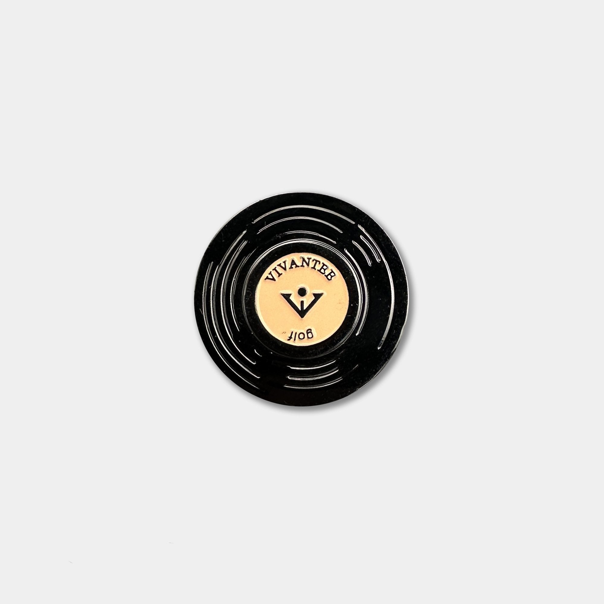 Aerial image of Black vinyl record-inspired fun golf ball marker with VIVANTEE logo engraved.
