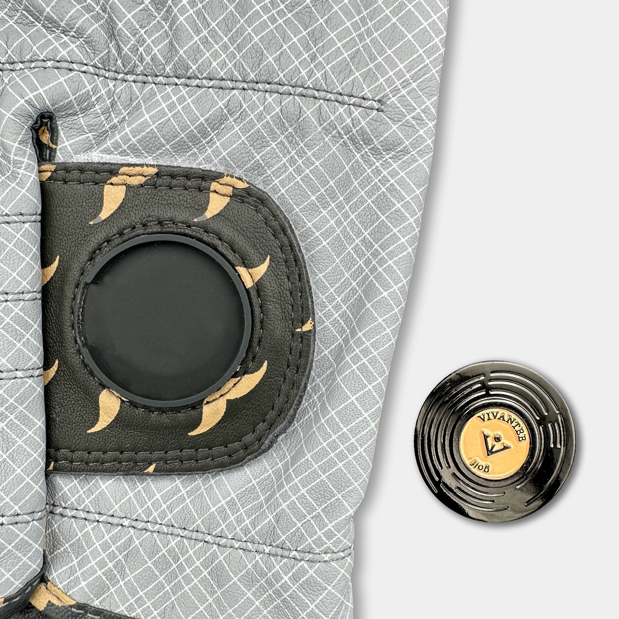 Close up of golf glove pull tag with a vinyl record magnetic ball marker with a stylish mustache pattern.