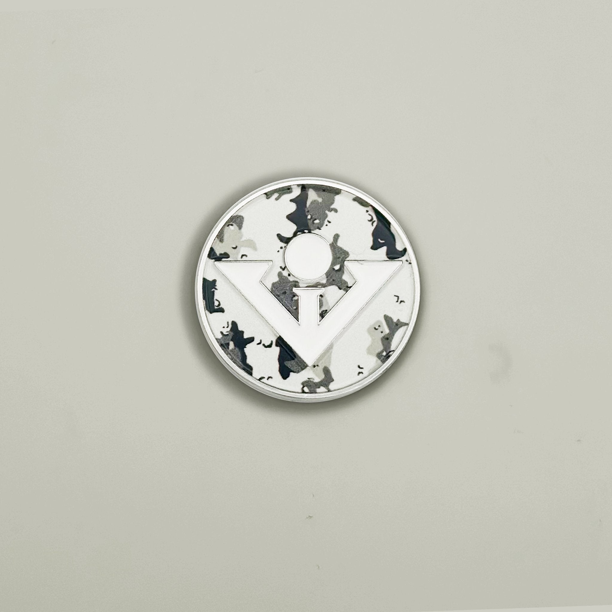 Camo Print Magnetic Golf Ball Marker with orange backdrop.