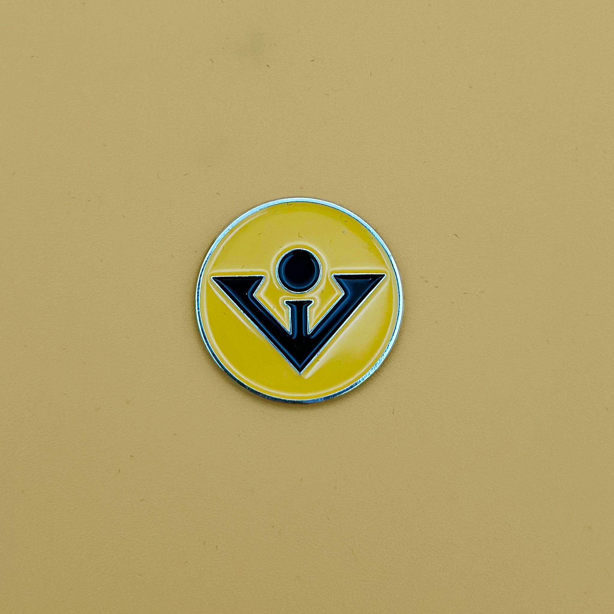 Top View of our black and tan magnetic golf ball marker