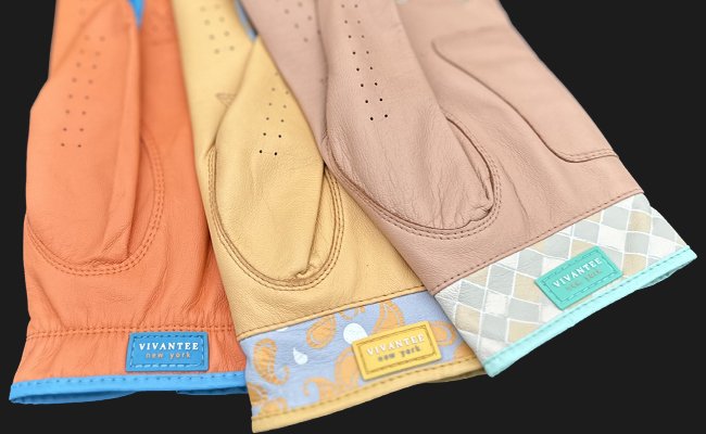 3 Pairs of golf gloves with magnetic ball markers in various colors and designs showcasing each unique label saying "VivanTee, New York".  