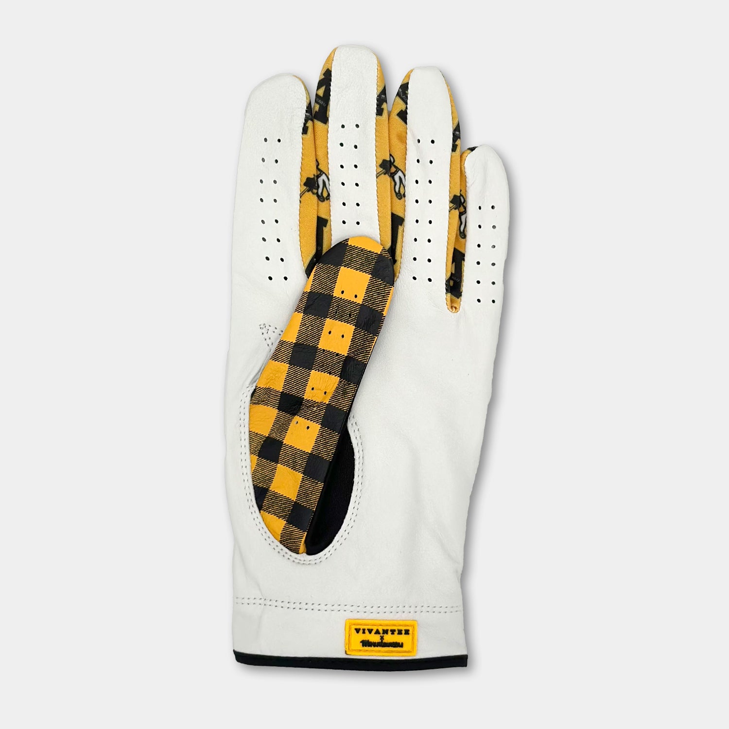 Yellow and black checkered custom golf glove with VivanTee x Mountaineer tag from top view.  