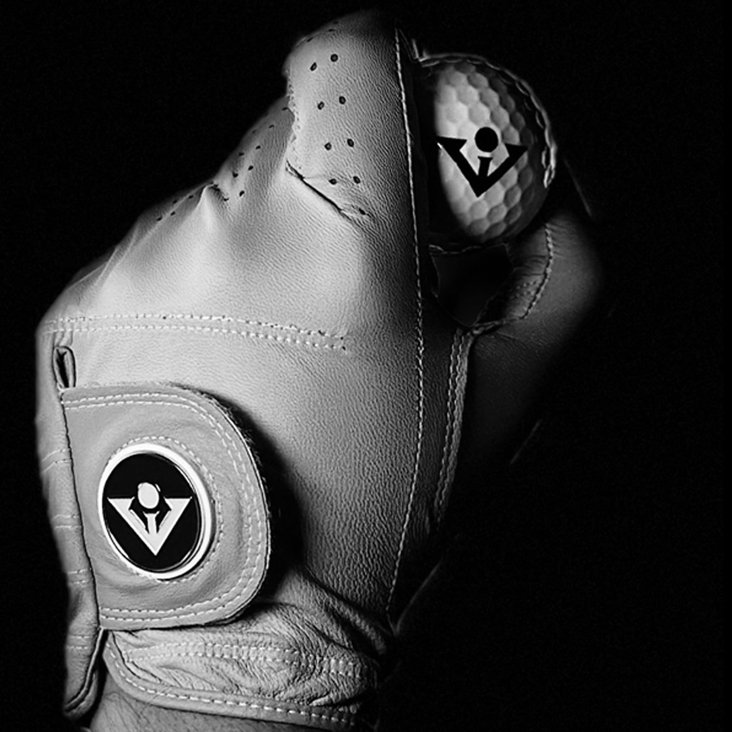 Close up of VivanTee golf gloves and the premium leather in a black and white photo.  