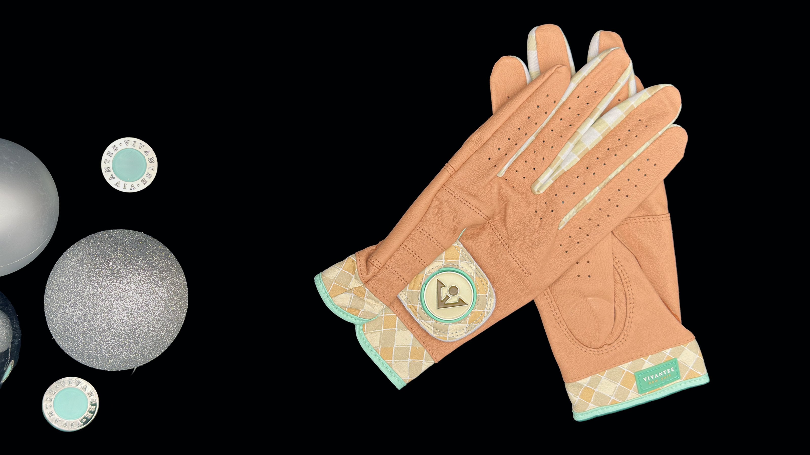 Tan golf gloves with magnetic ball markers laid out next to holiday ornaments.