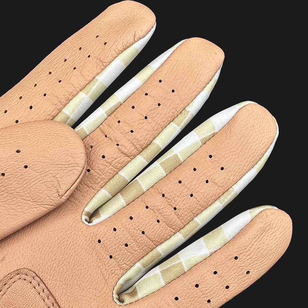 Brown golf glove with plaid lycra fingers close up with dark background.
