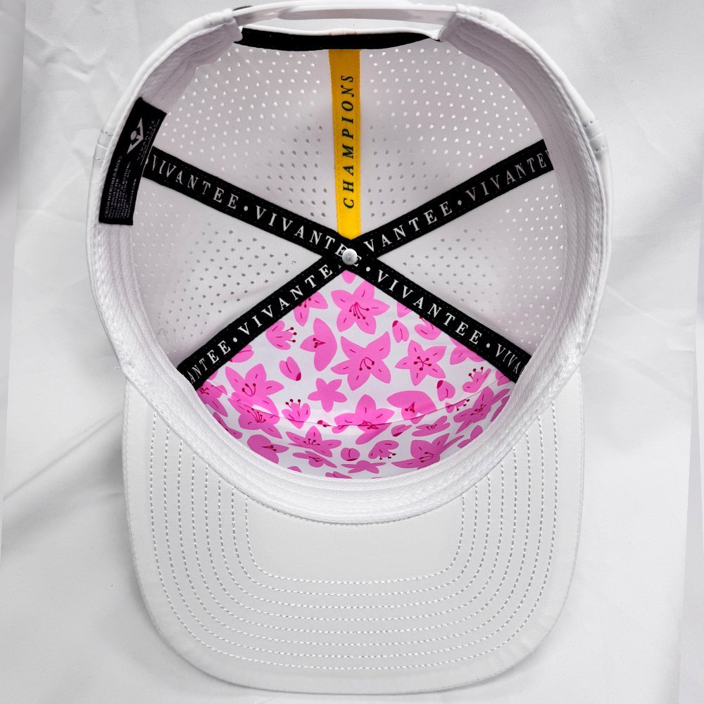 Master's inspired golf hat with azaelas on the inside on a white background.