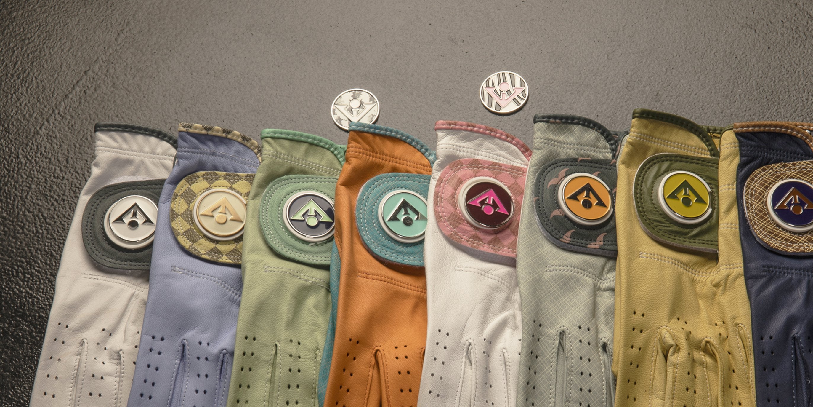 Line of VivanTee designer golf gloves across a variety of different colors and styles.