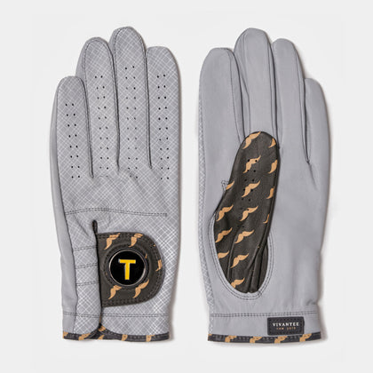 Golf glove with magnetic ball marker next to tees, a coffee, and Nike shoes to represent the NYC inspiration of the design.