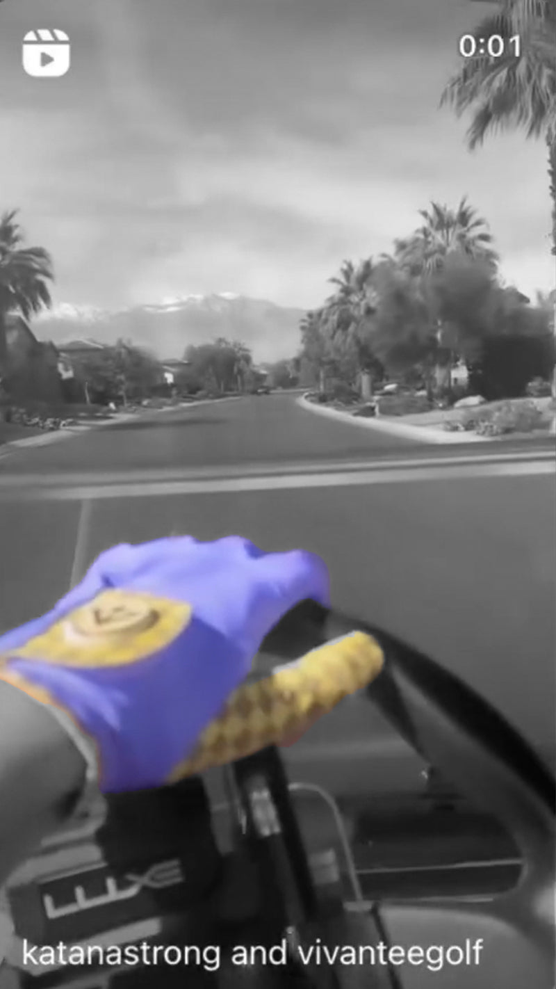Golfer driving in golf cart listening to music with purple background and purple golf glove with magnetic ball marker..  