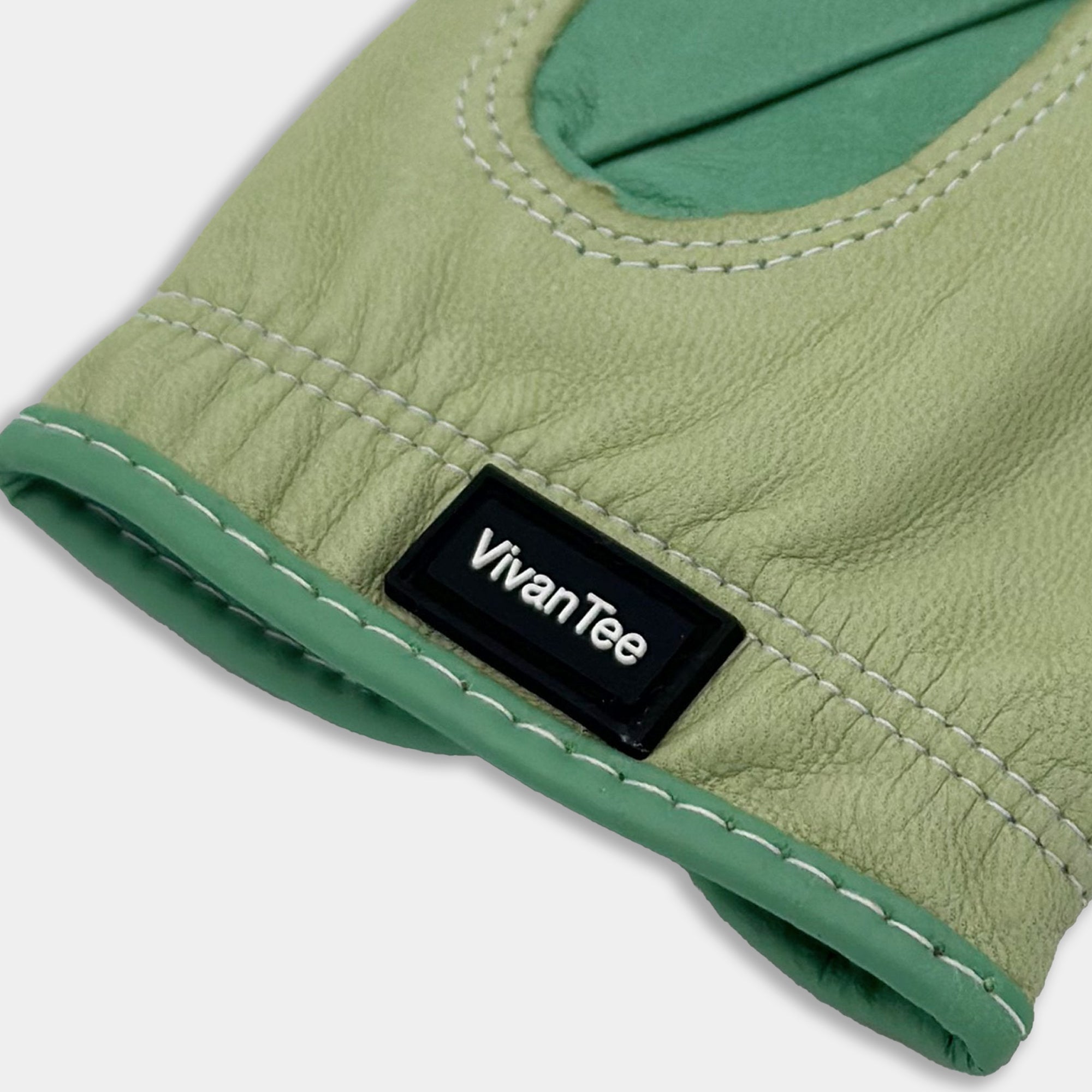 Close up of VivanTee pull tab on mint green golf glove
