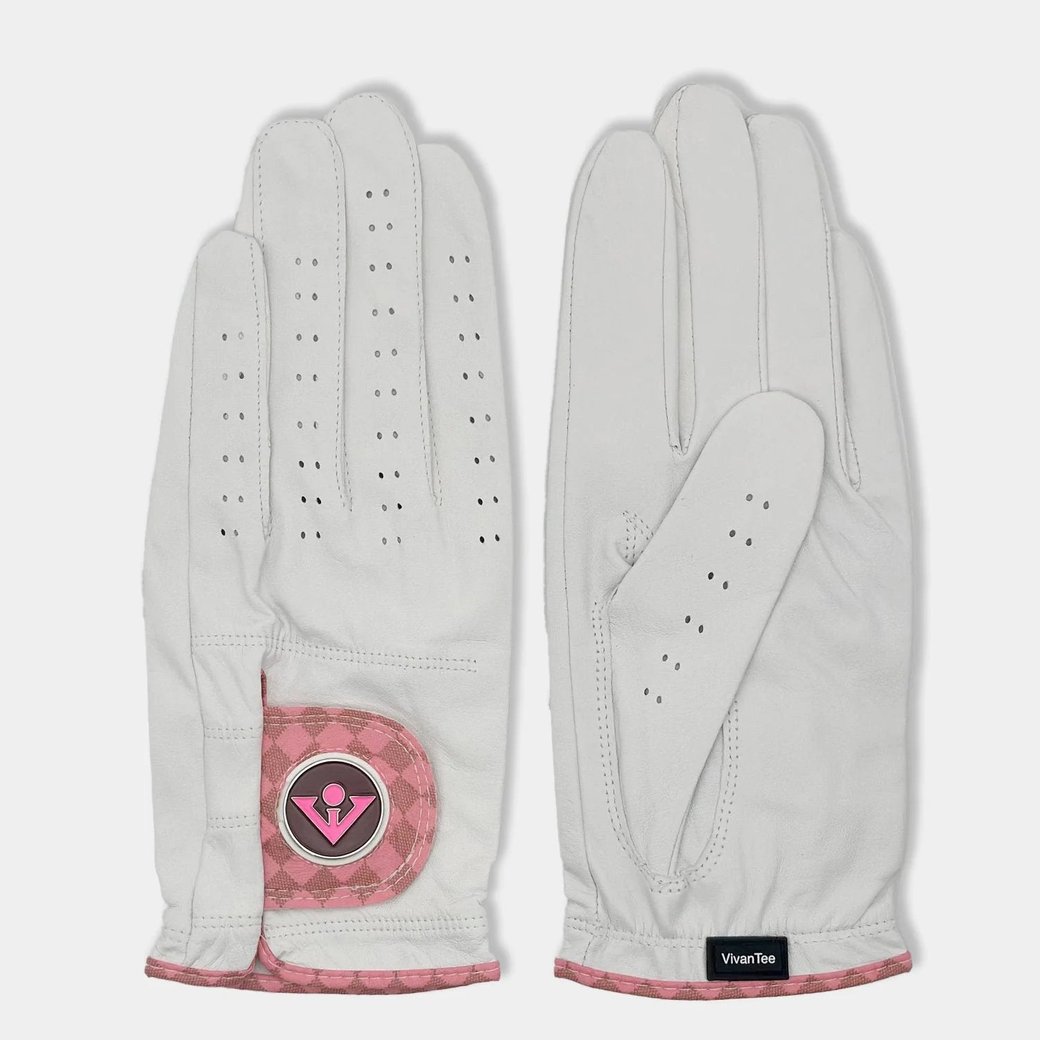 White and blush pink designer golf glove with a black backdrop to show case the unique colors and patterns.