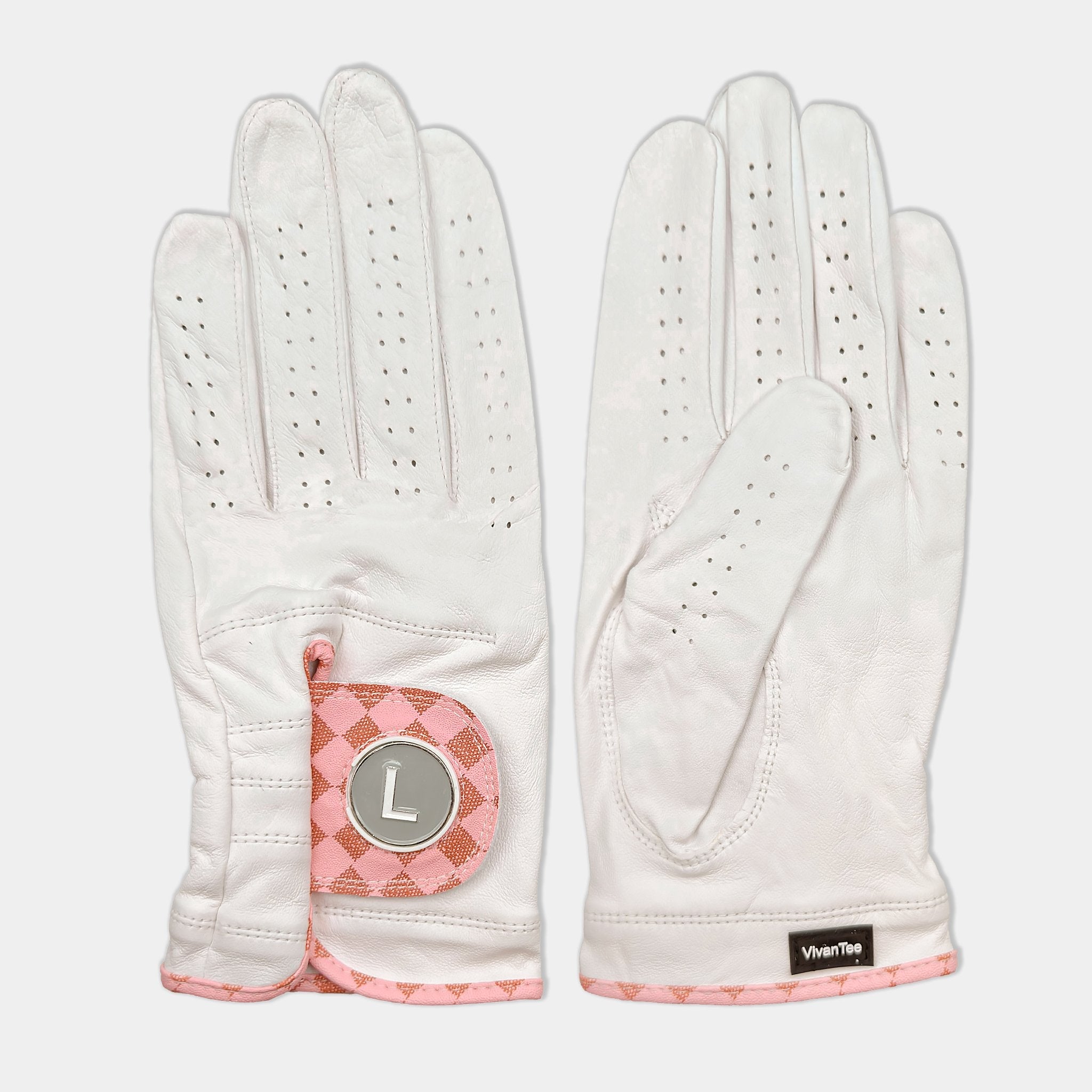 White and blush pink designer golf glove with a black backdrop to show case the unique colors and patterns.