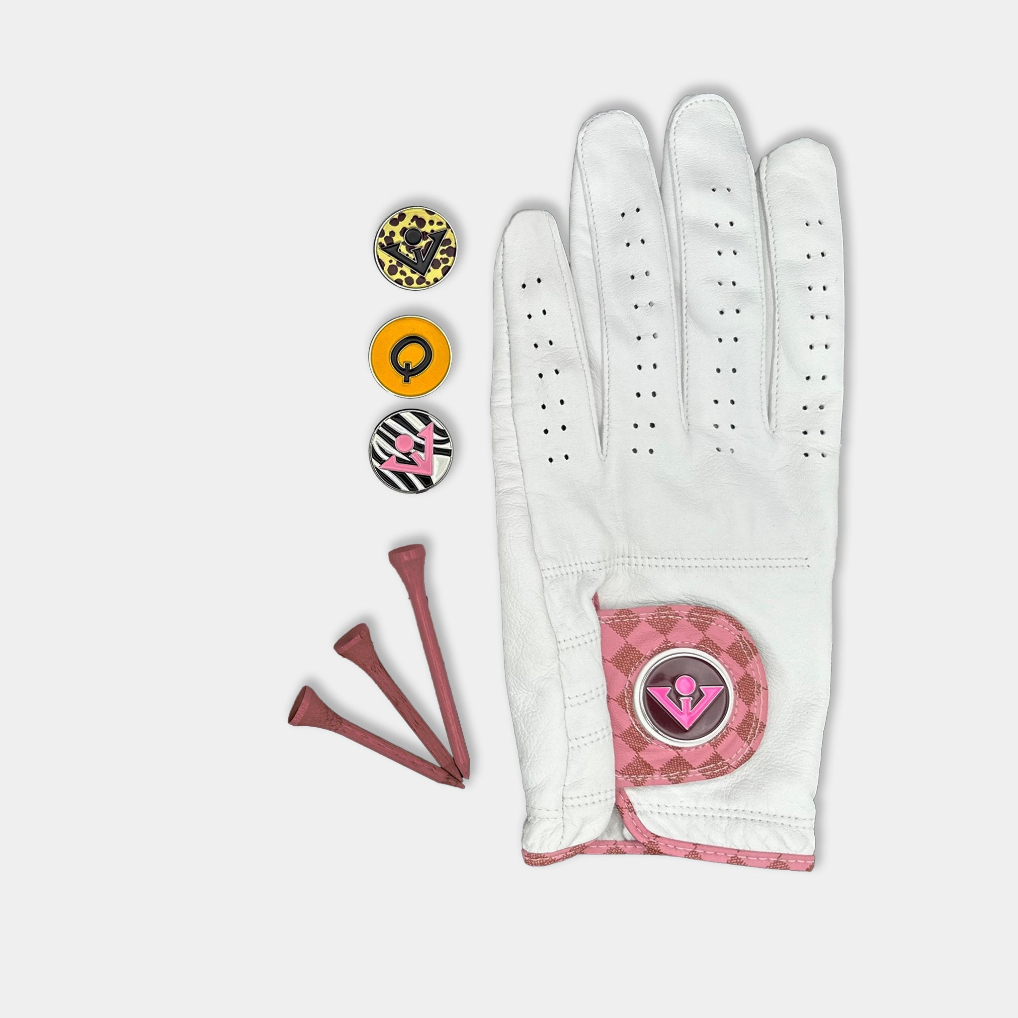 White and blush pink designer golf glove with a black backdrop to show case the unique colors and patterns.