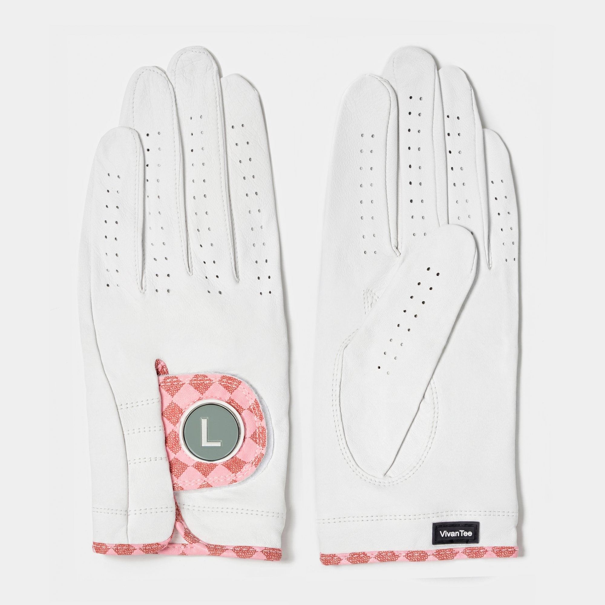White and blush pink designer golf glove with a black backdrop to show case the unique colors and patterns.