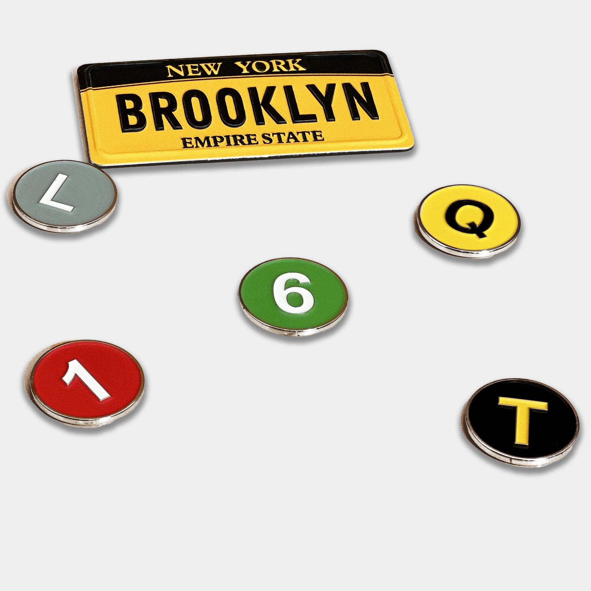 Subway line Golf Ball Markers with the L, 1, Q, T, and 6 train.
