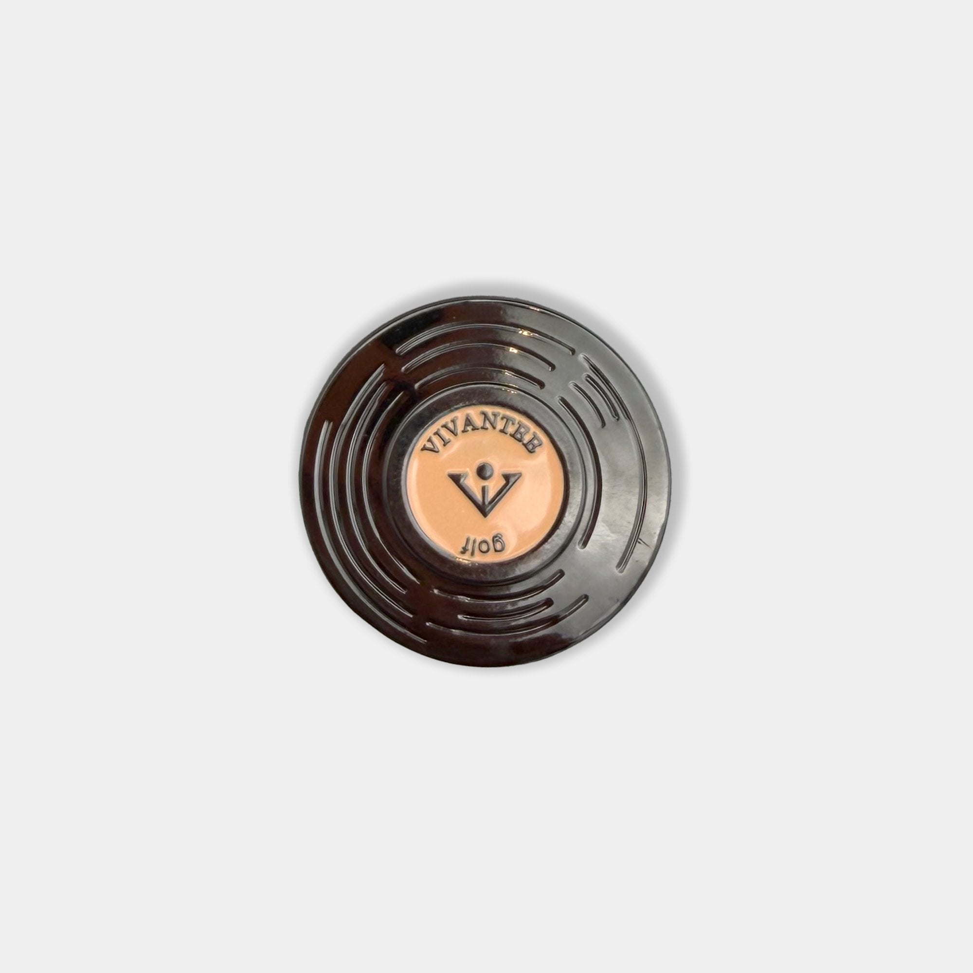 Aerial image of Black vinyl record-inspired fun golf ball marker with VIVANTEE logo engraved.