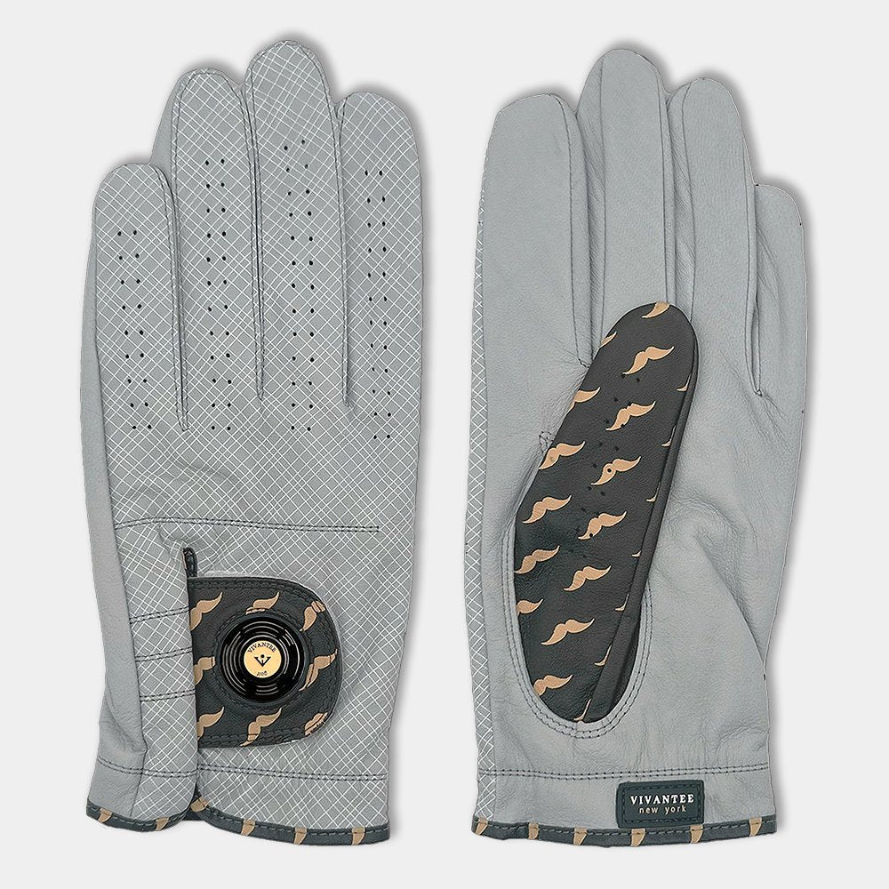 Golf glove with magnetic ball marker next to tees, a coffee, and Nike shoes to represent the NYC inspiration of the design.