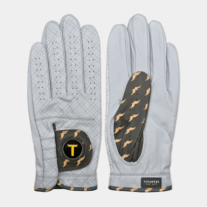 Golf glove with magnetic ball marker next to tees, a coffee, and Nike shoes to represent the NYC inspiration of the design.