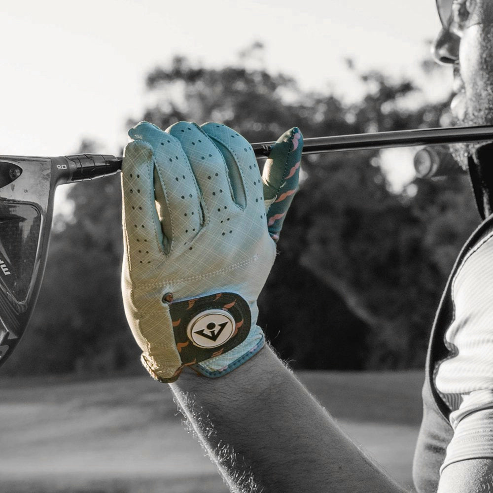 Men's VivanTee golf glove featuring a light grey plaid pattern and mustache design, holding a driver with a white ball marker.