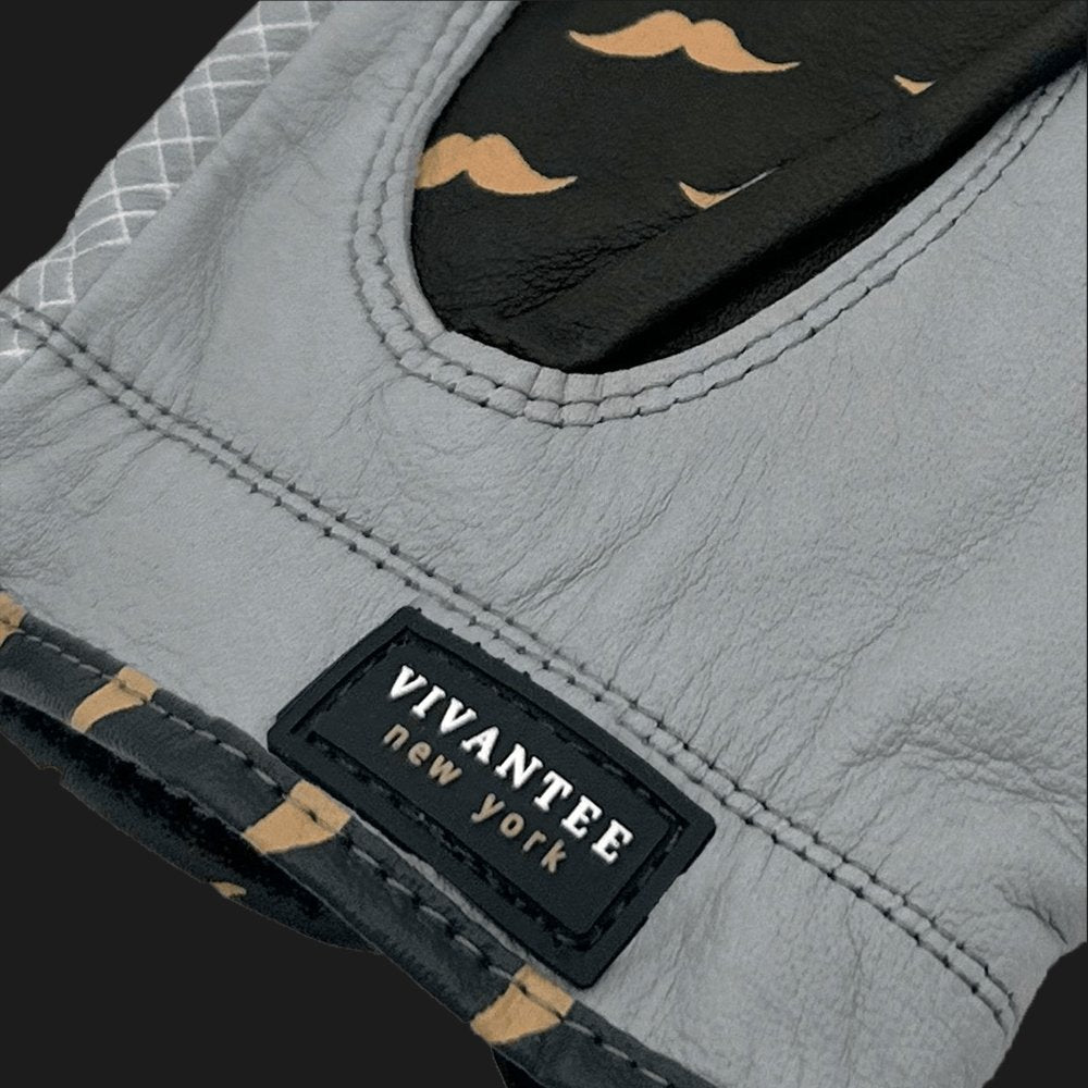 Gray golf glove with a black label reading 'Vivantee New York' on a dark background