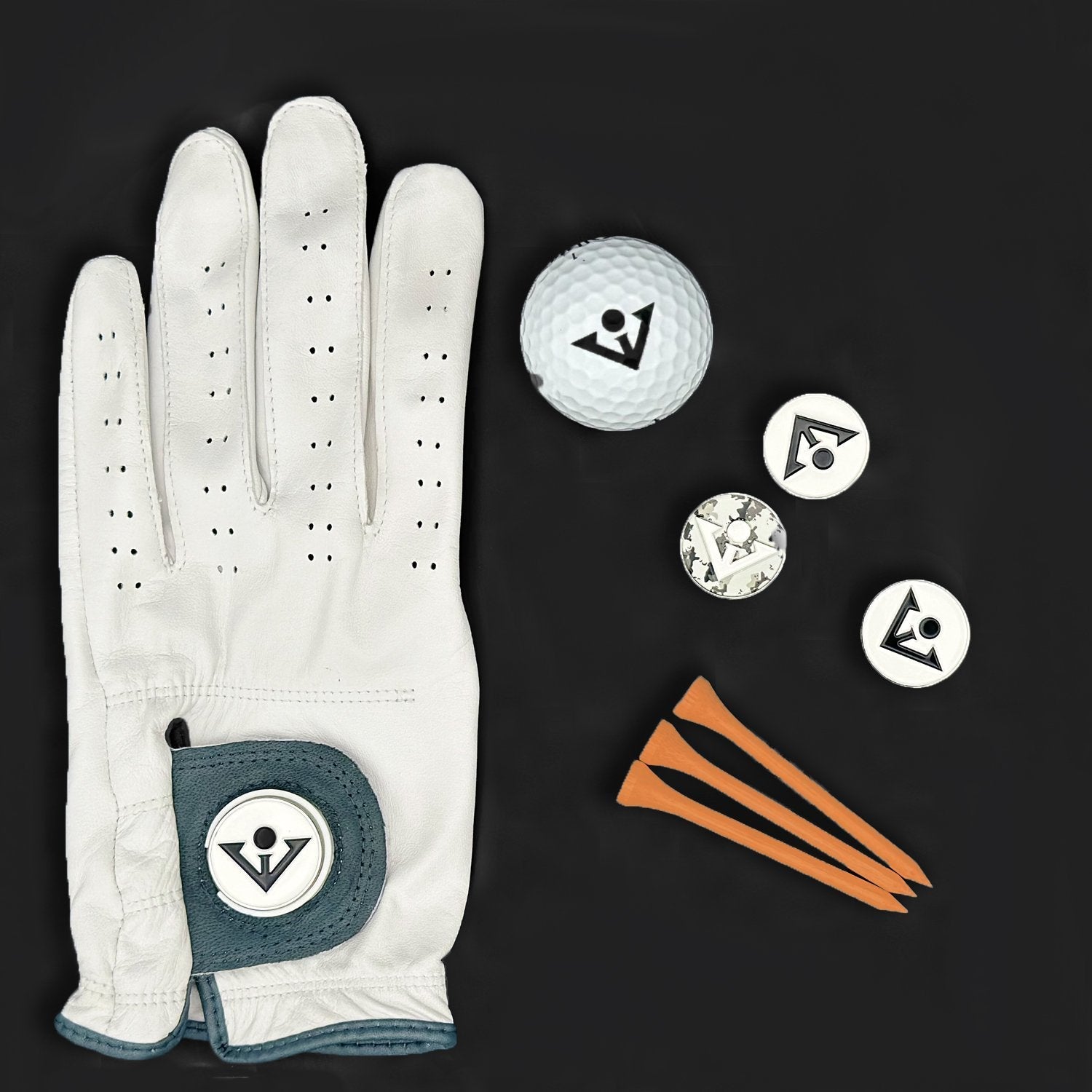 Women's Grey and white leather golf glove next to a ball and ball markers with the VivanTee logo, and tees.