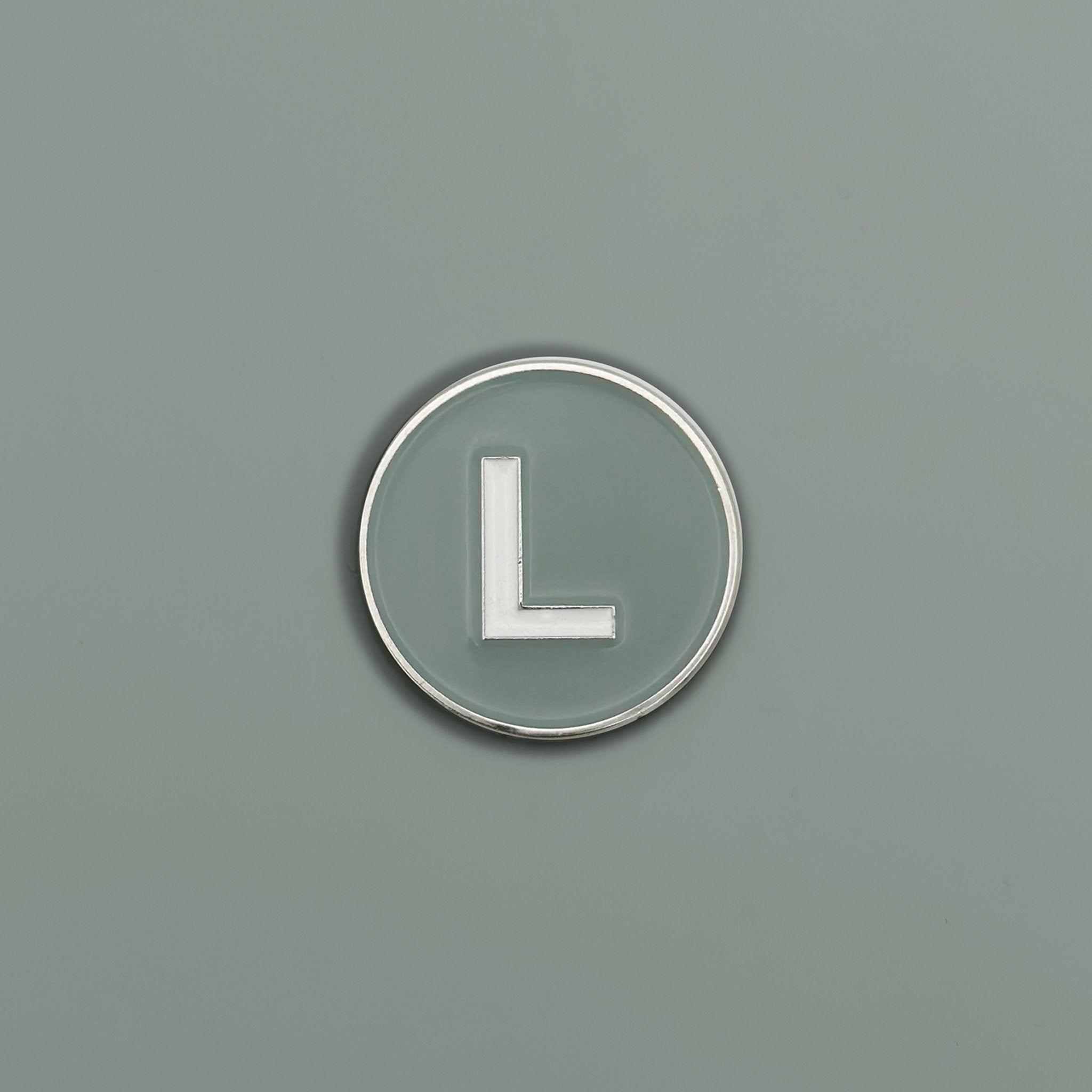 Front view of L Train Grey Magnetic Golf Ball Marker